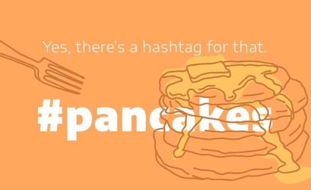 artists' impression of a cake and a fork accompanied with the word pancake and a hashtag symbol